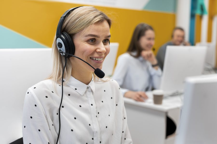 Blond woman working call center with headphones computer 1 copy
