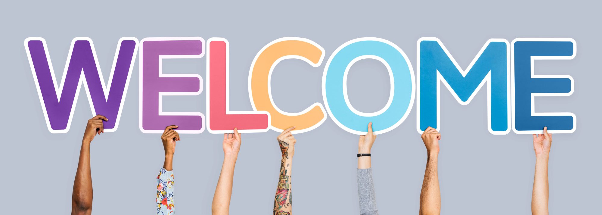 Hands holding word welcome copy