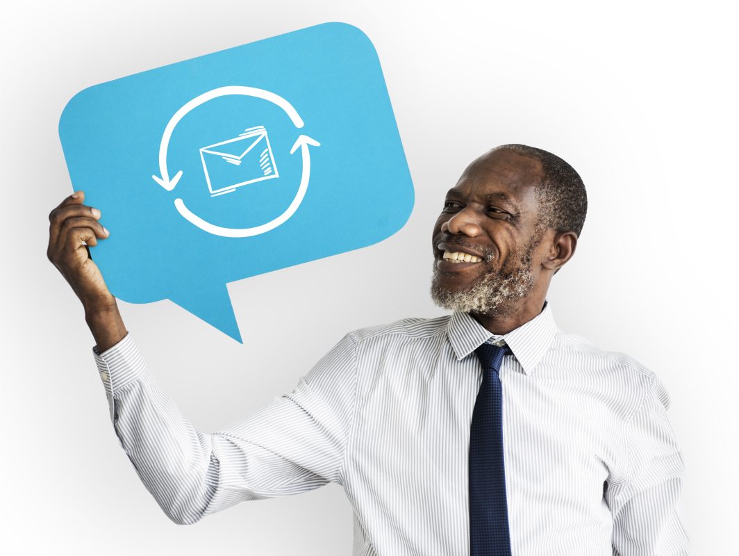 Happy man holding email symbol copy
