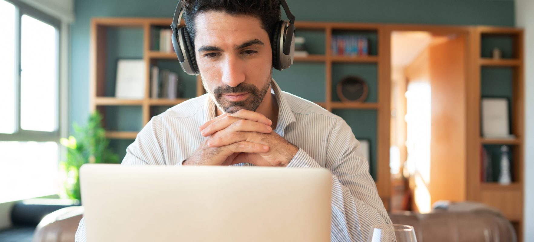 Portrait young man work video call with laptop from home home office concept new normal lifestyle copy