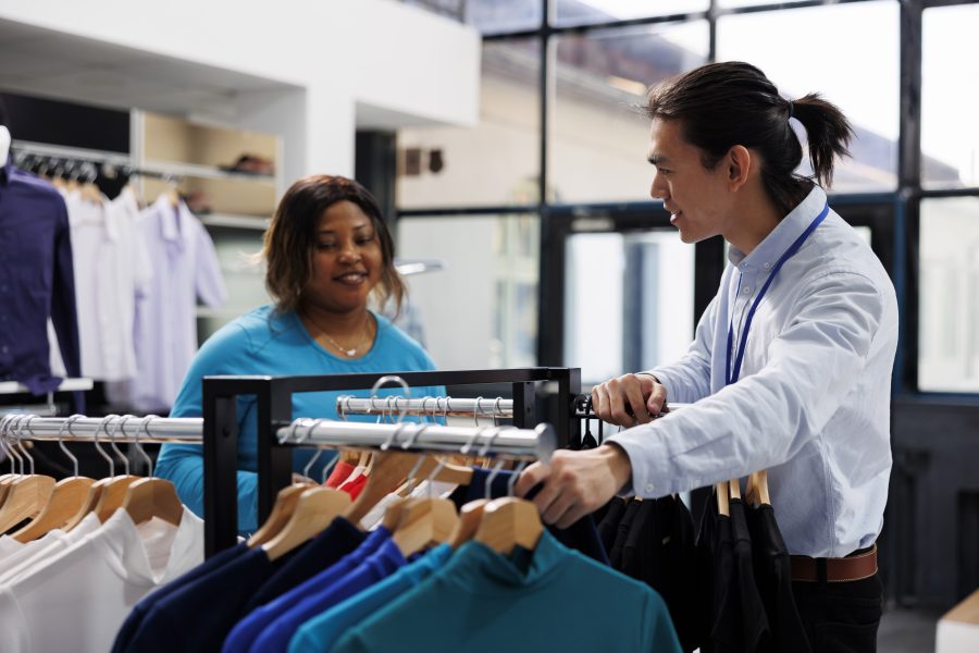 African american customer looking casual wear shopping stylish merchandise modern boutique shopaholic woman wanting new wardrobe buying fashionable clothes clothing store copy