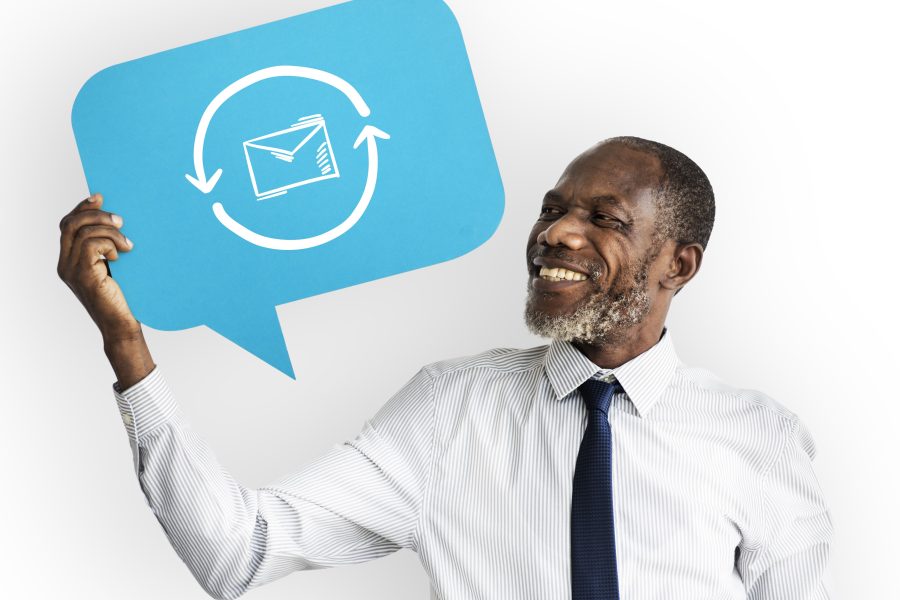 Happy man holding email symbol copy