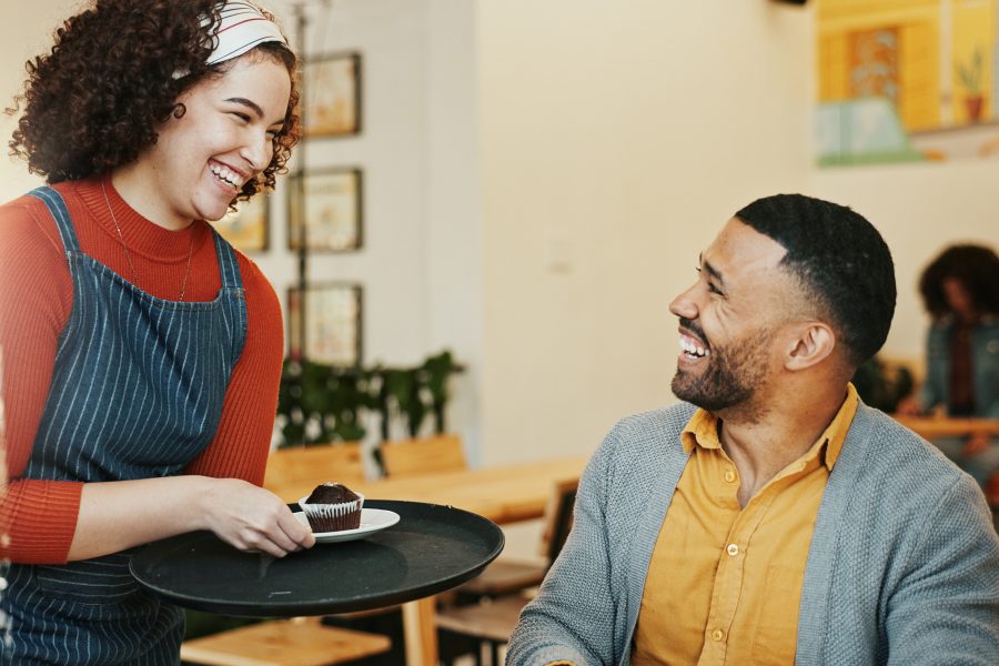 Hospitality customer waitress cafe with cake client order smile table barista woman man service restaurant sweet treat small business local support coffee shop copy